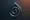 Glossy spiral inside a droplet shape, symbolizing craving, loops, or internal cycles.