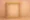Abstract blurred golden picture frame symbolizing nostalgic, rose-tinted memories and the deceptive Rosy Effect linked to alcohol